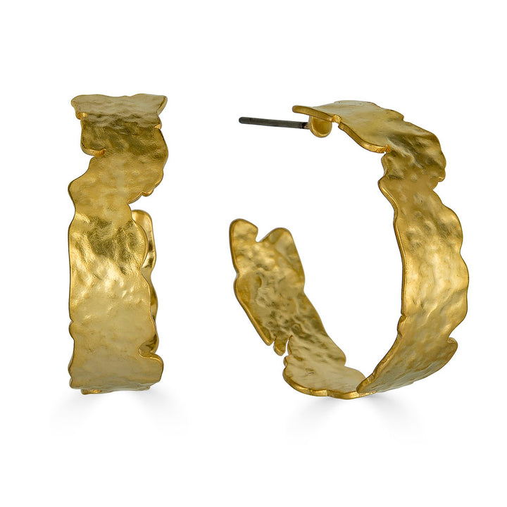large hammered gold hoop earring.