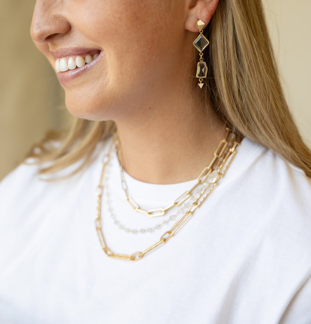 Asymmetrical quartz fancy cut crystals on an asymmetrical post