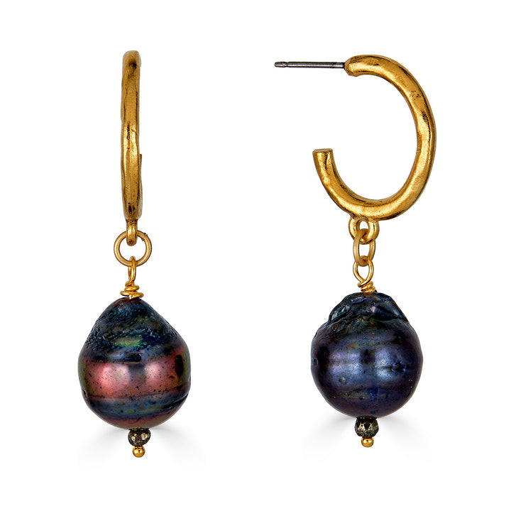 a black baroque pearl earring on a gold hoop