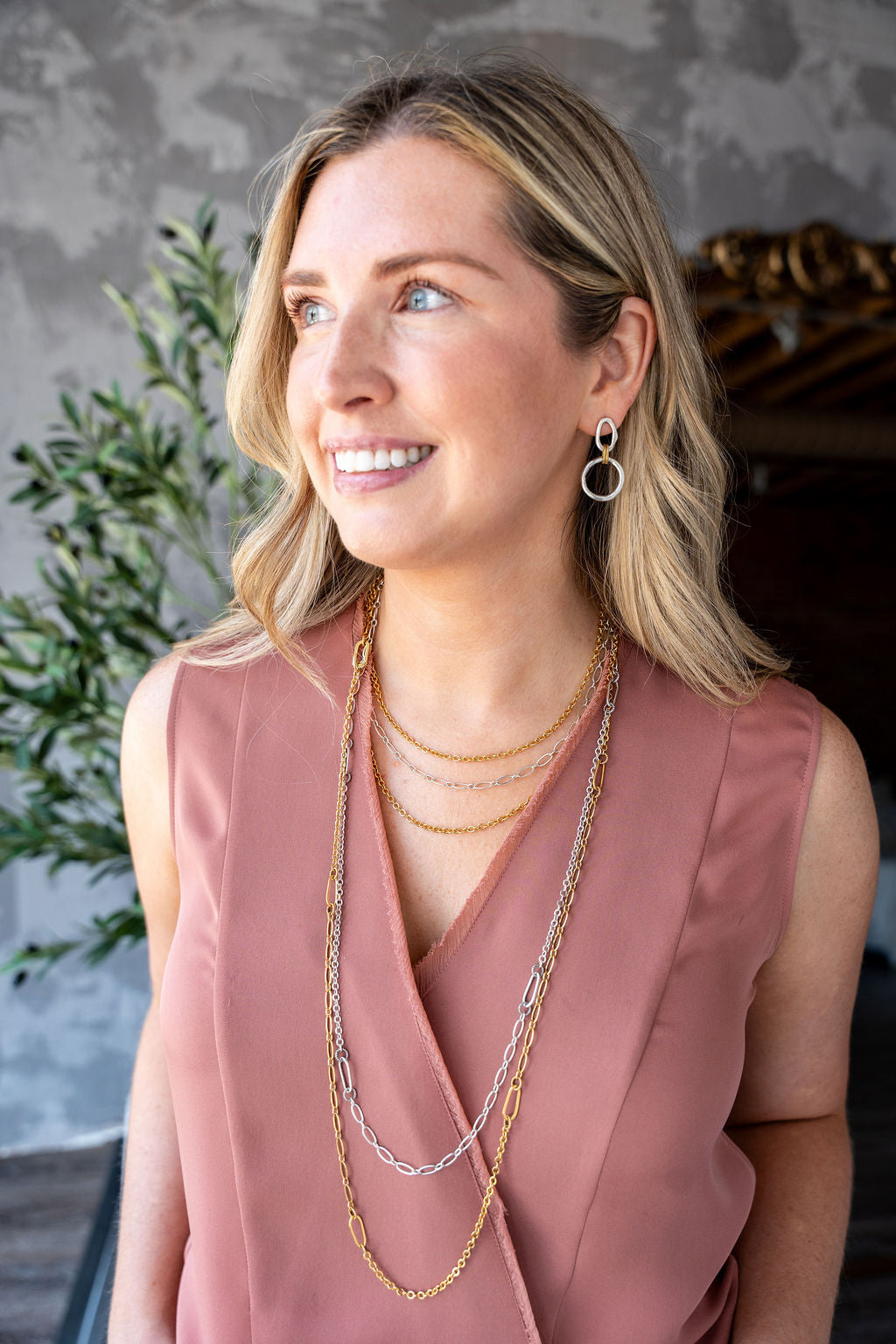 Long gold chain necklace with delicate textured links, designed for layering or doubling