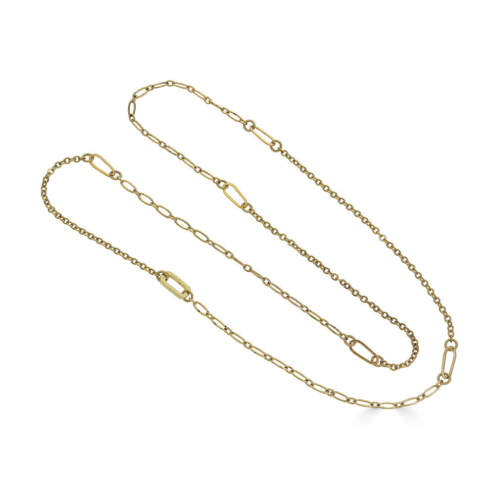 Long gold chain necklace with delicate textured links, designed for layering or doubling