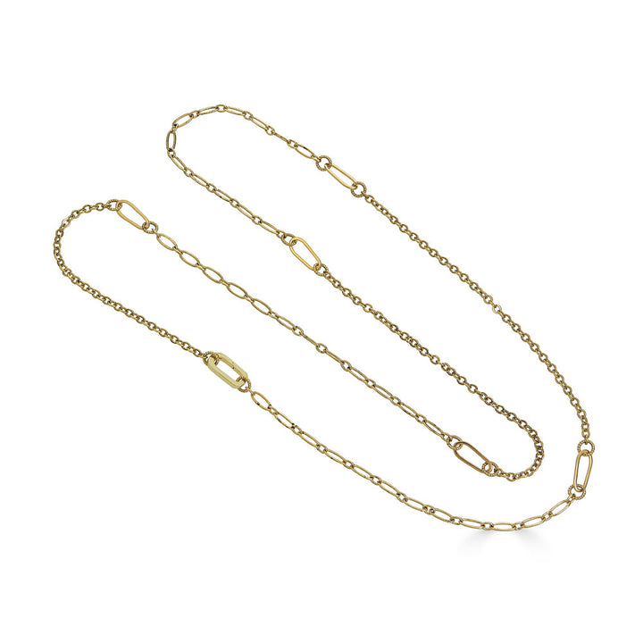 Long gold chain necklace with delicate textured links, designed for layering or doubling
