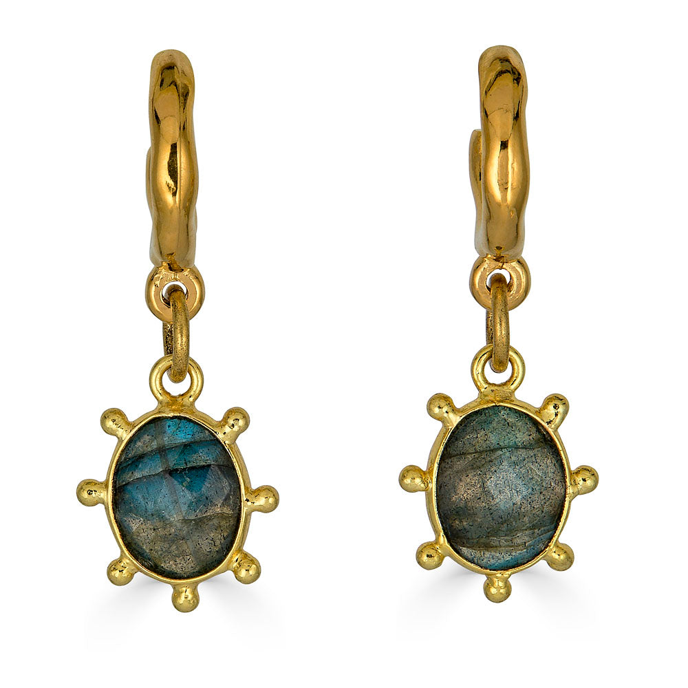Gold hoop earrings with hammered finish and fixed oval labradorite charm framed by rounded prongs.