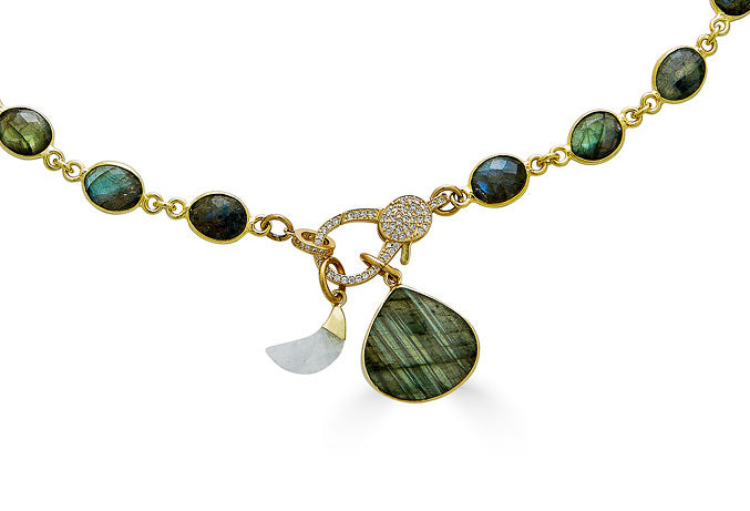 a labradorite necklace with a heart shaped labradorite pendant and a moonstone moon with a pave clasp