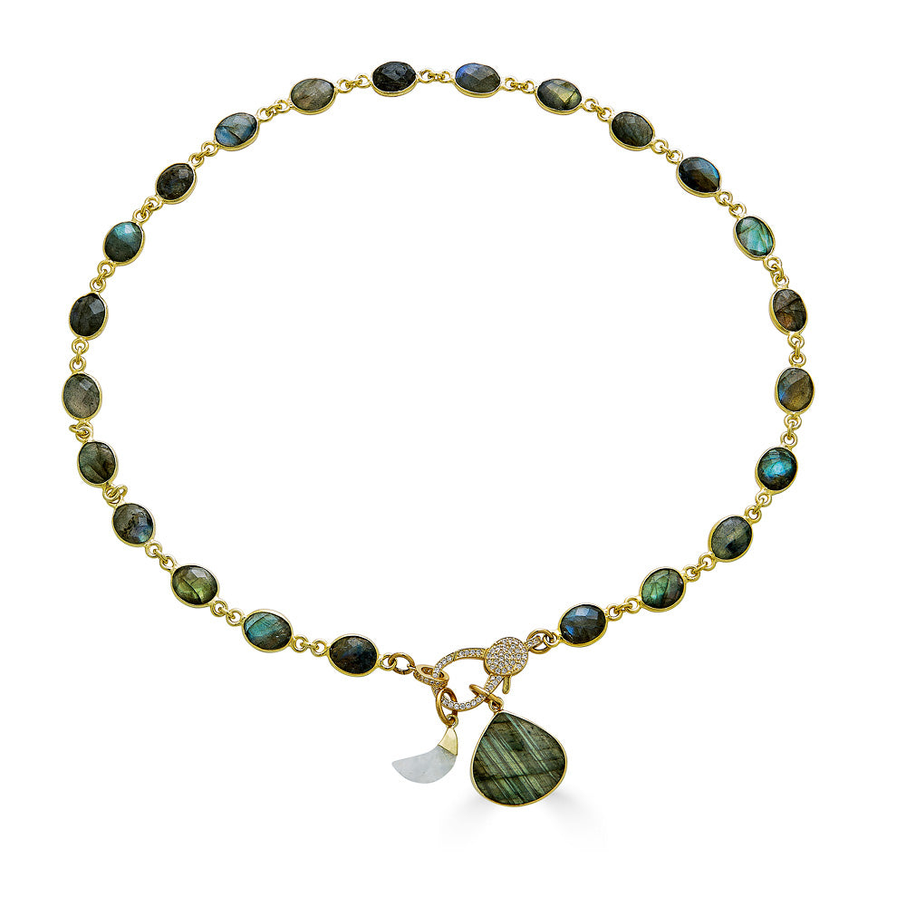 a labradorite necklace with a heart shaped labradorite pendant and a moonstone moon with a pave clasp