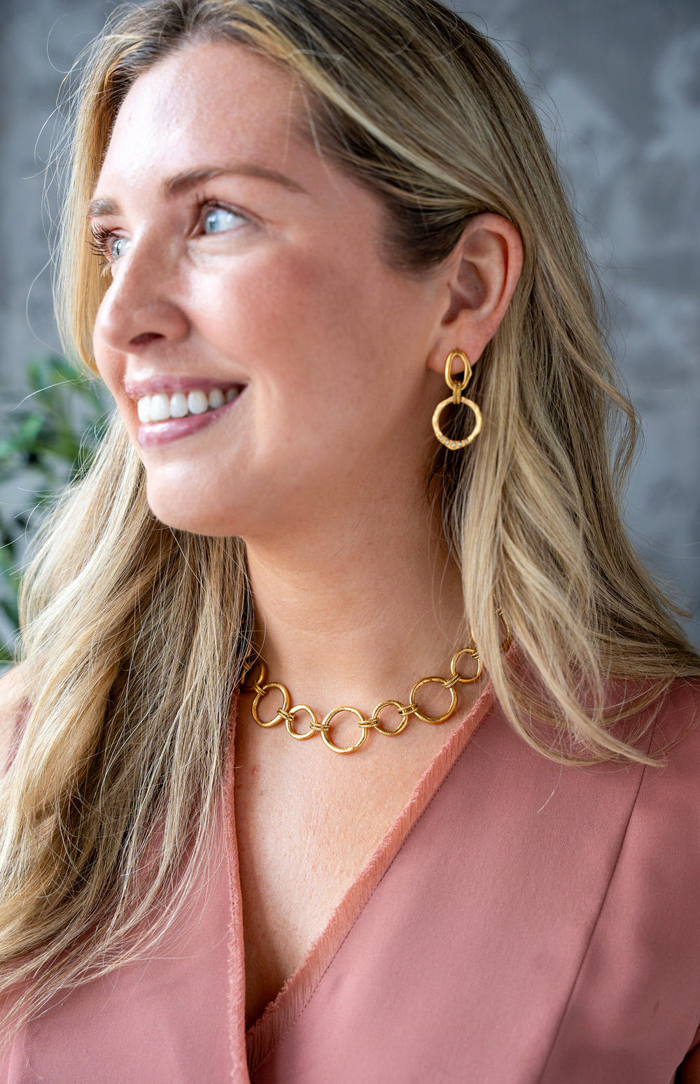 Matte gold sculpted circle necklace with textured round links and toggle clasp, styled three ways including lariat.