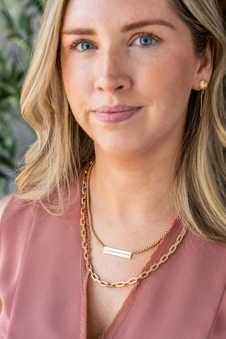 Matte gold adjustable lariat necklace with rectangular chain links and lobster clasp closure.