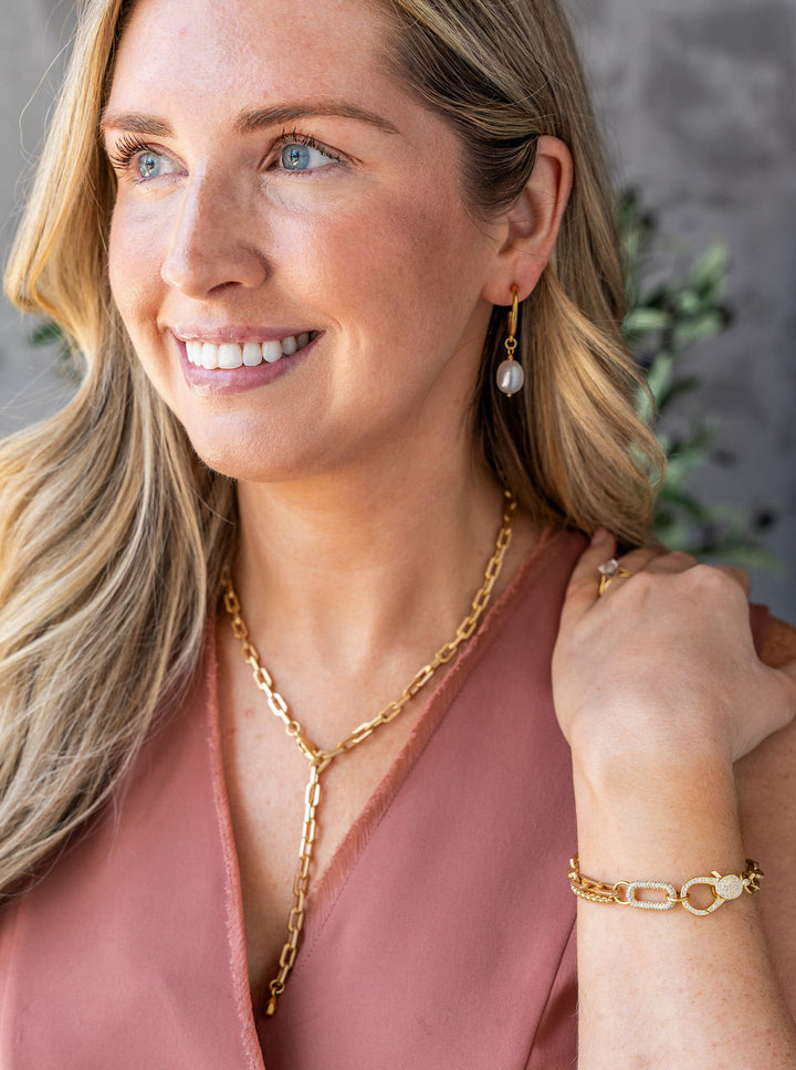 Matte gold adjustable lariat necklace with rectangular chain links and lobster clasp closure.