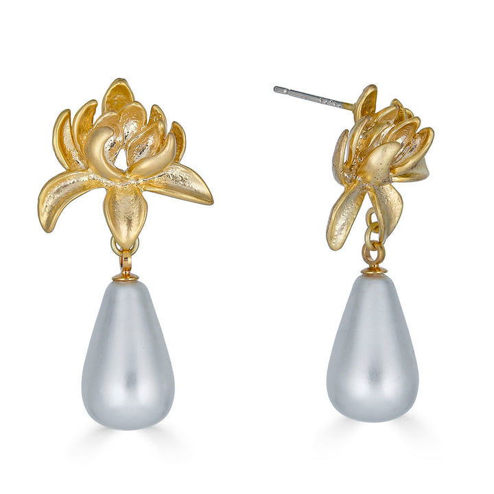 Gold lily-shaped earrings with teardrop silver shell pearl drops and post back closures.