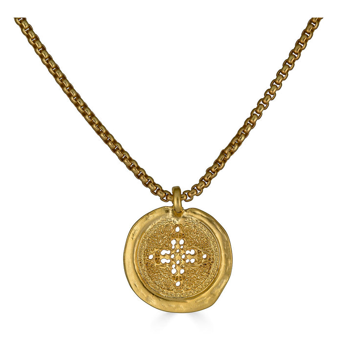 Matte gold coin necklace with filigree-etched round pendant on a rounded box chain.