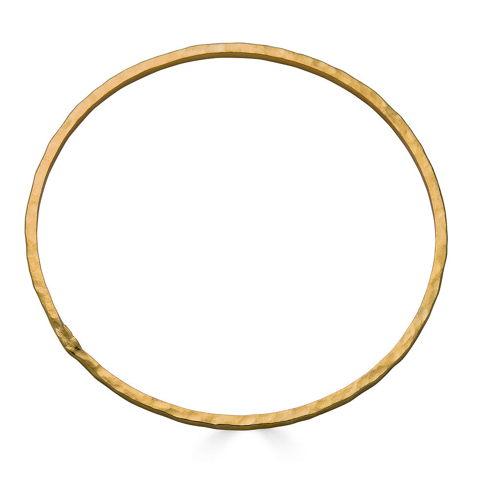 Slim gold bangle bracelet with a hammered finish.