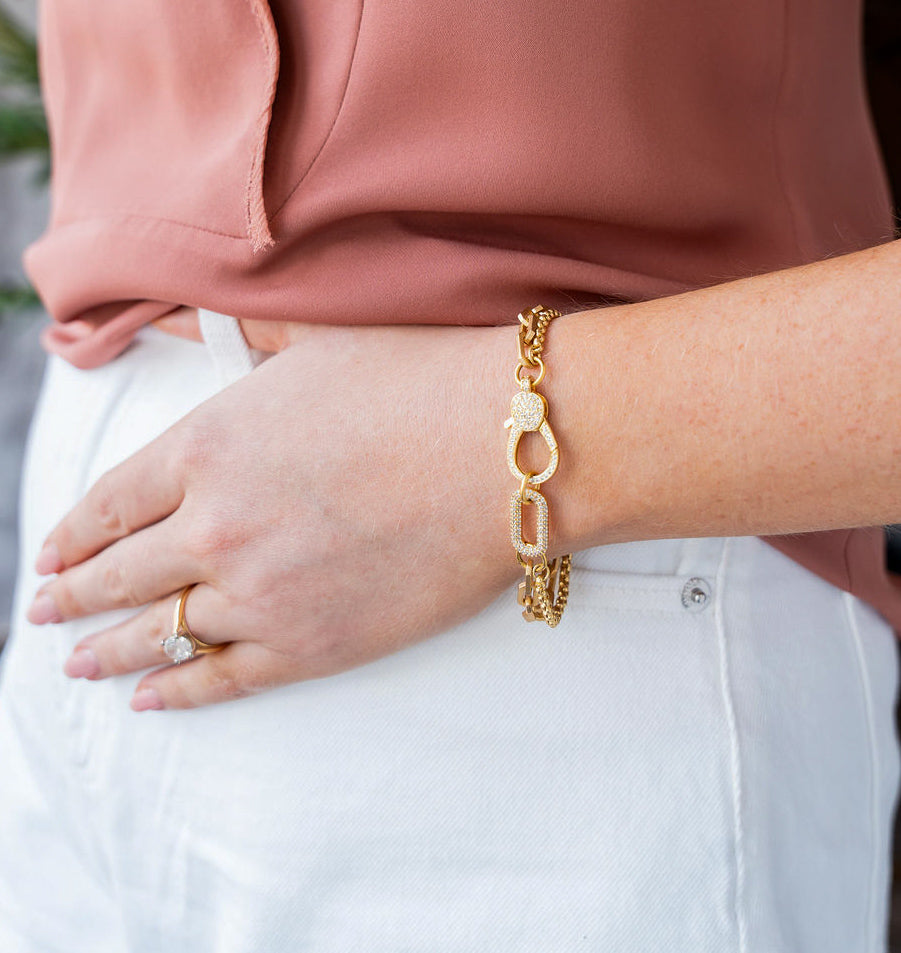 Sleek gold bracelet with pavé clasp and mixed chains. The Pavé Connector Bracelet is bold, modern, and stackable — perfect on its own or layered.