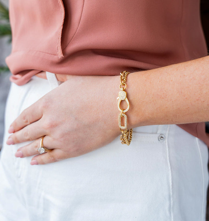 Sleek gold bracelet with pavé clasp and mixed chains. The Pavé Connector Bracelet is bold, modern, and stackable — perfect on its own or layered.