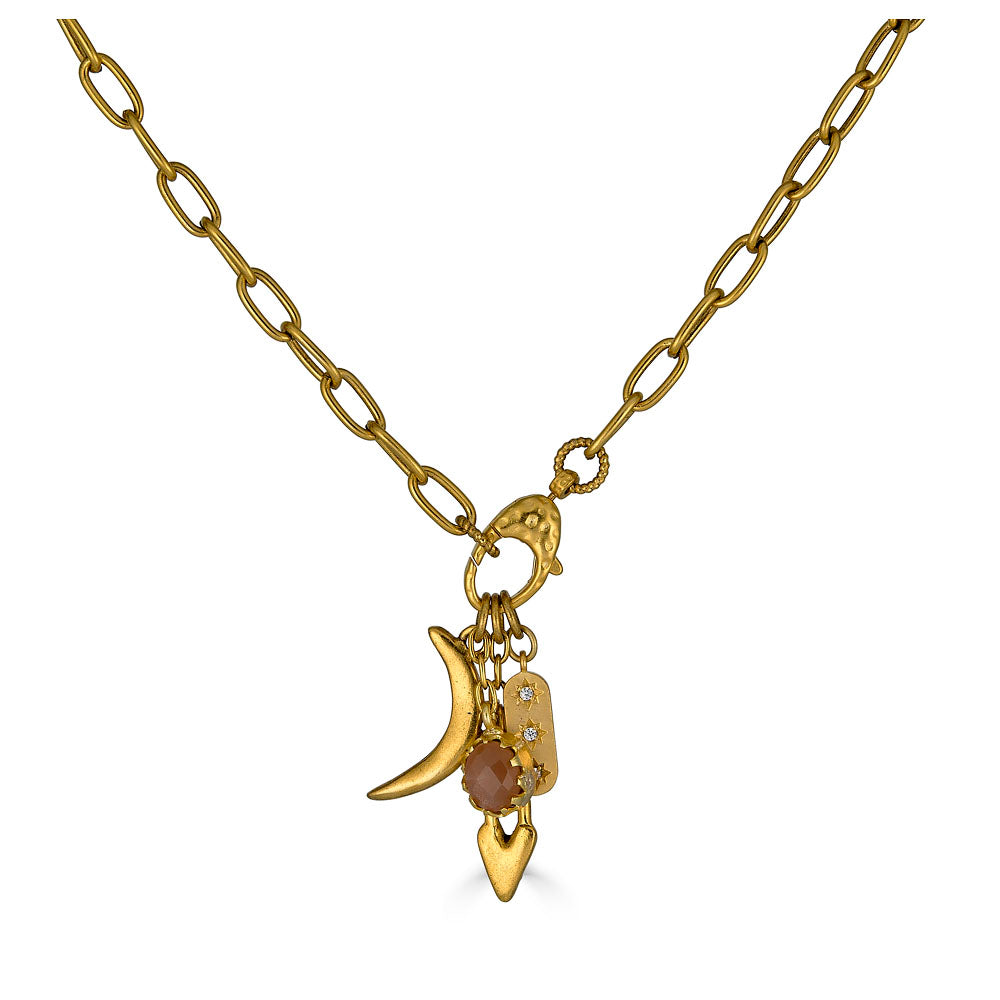 Gold necklace featuring a peach moonstone drop and charm cluster with crescent moon and heart details.