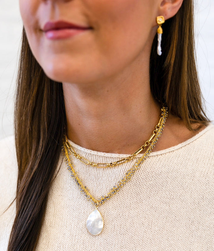 A gold mixed link layering chain
