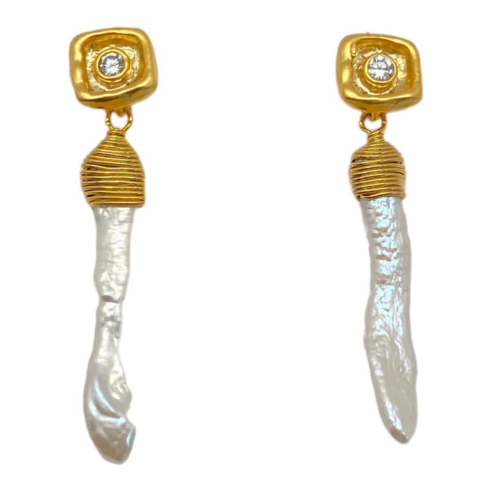 A baroque pearl shard on a crystal post