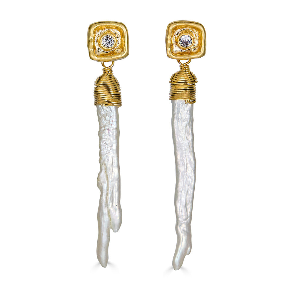 A baroque pearl shard on a crystal post