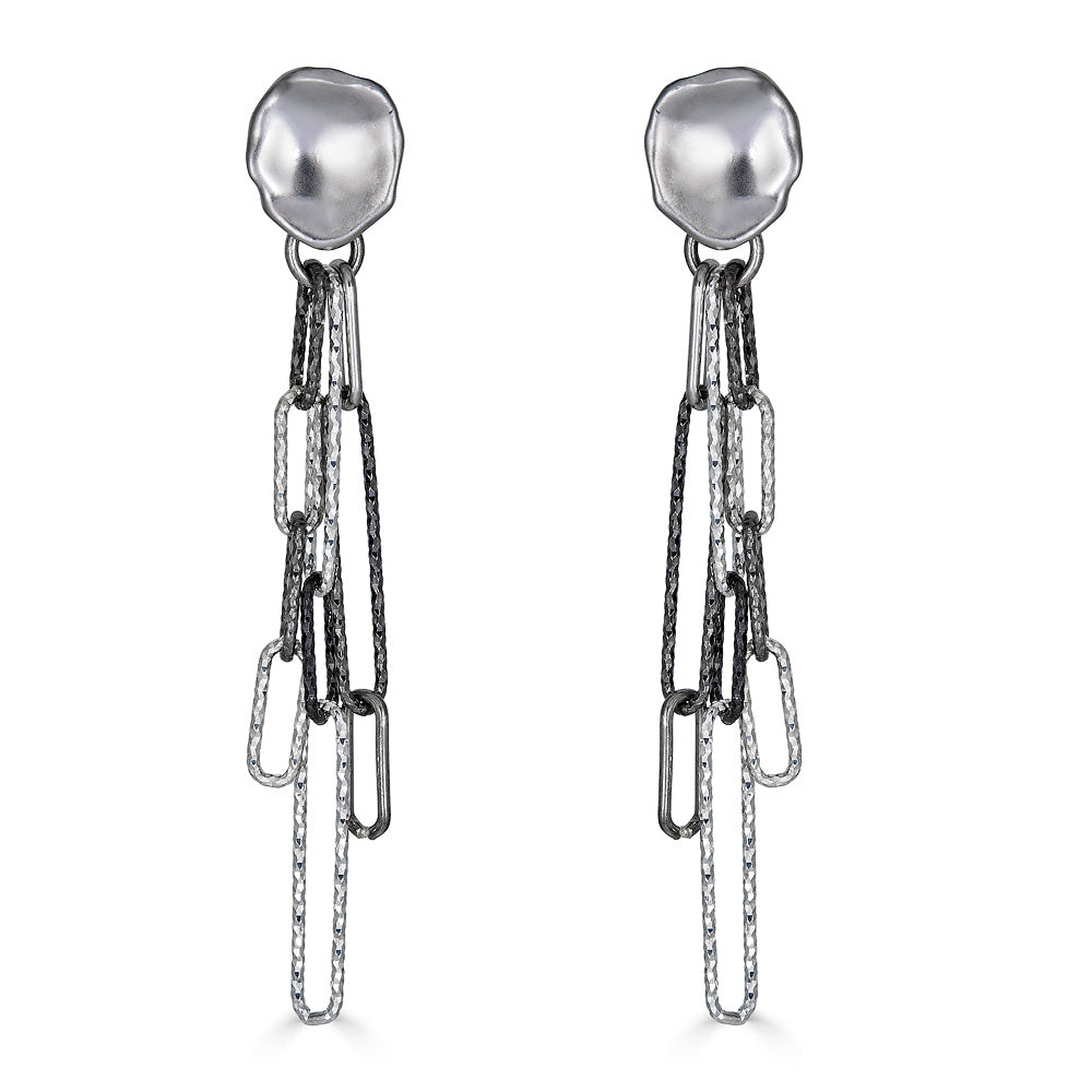 A mixed metal earring with silver and rhodium paperclip links on a lotus post earring