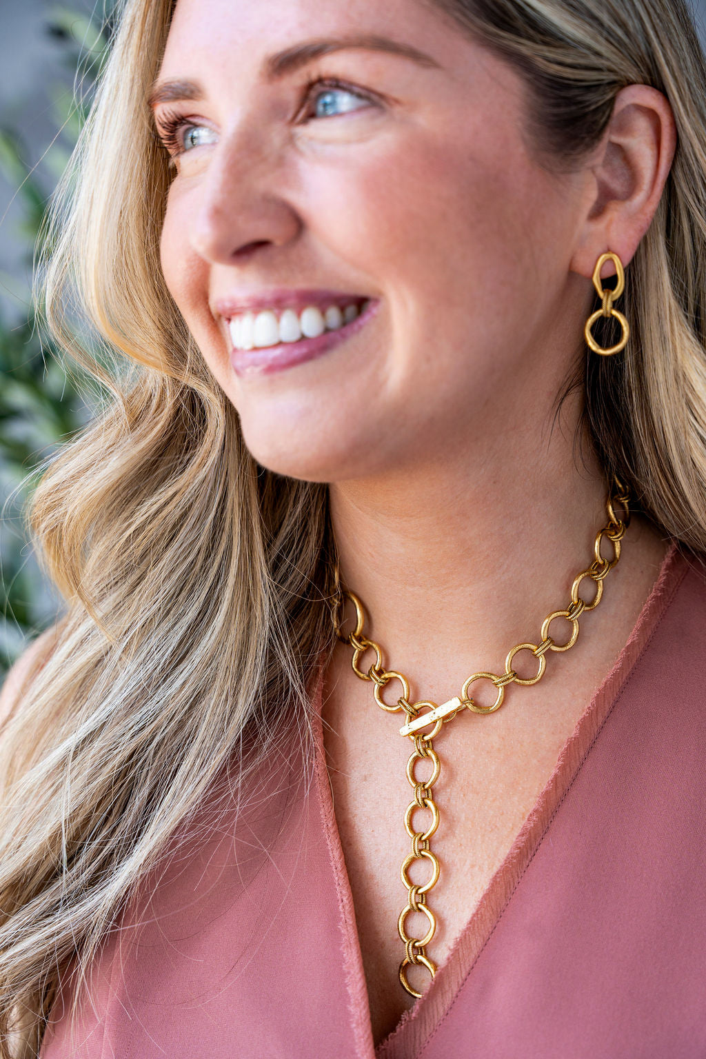 Matte gold sculpted circle necklace with textured round links and toggle clasp, styled three ways including lariat.