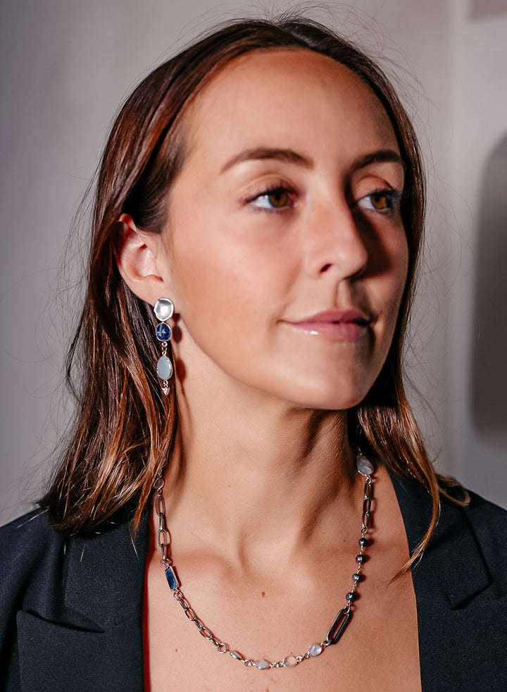 A silver mixed gemstone necklace with chalcedony, kyanite, moonstone and pearls.