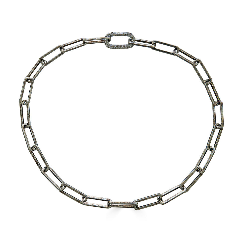 A silver chunky rectangle chain necklace with an oval pave clasp.