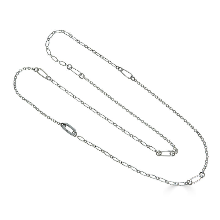 Long silver chain necklace with mixed delicate links, designed for layering or wearing doubled.