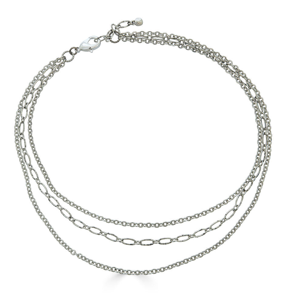 Silver-colored three-strand necklace with delicate mixed chain styles and adjustable clasp