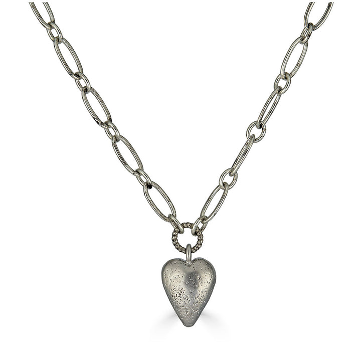 Silver heart charm necklace with elongated chain and brushed metal heart pendant
