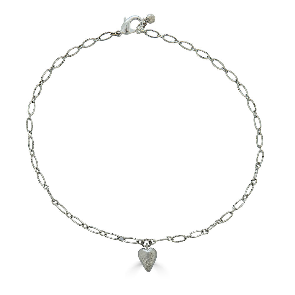 Silver heart charm necklace with elongated chain and brushed metal heart pendant