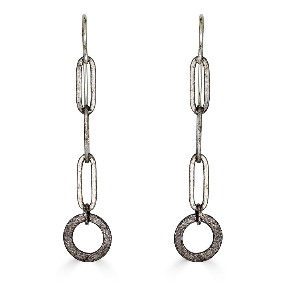 A pair of silver paperclip chain earrings with hoop detail.