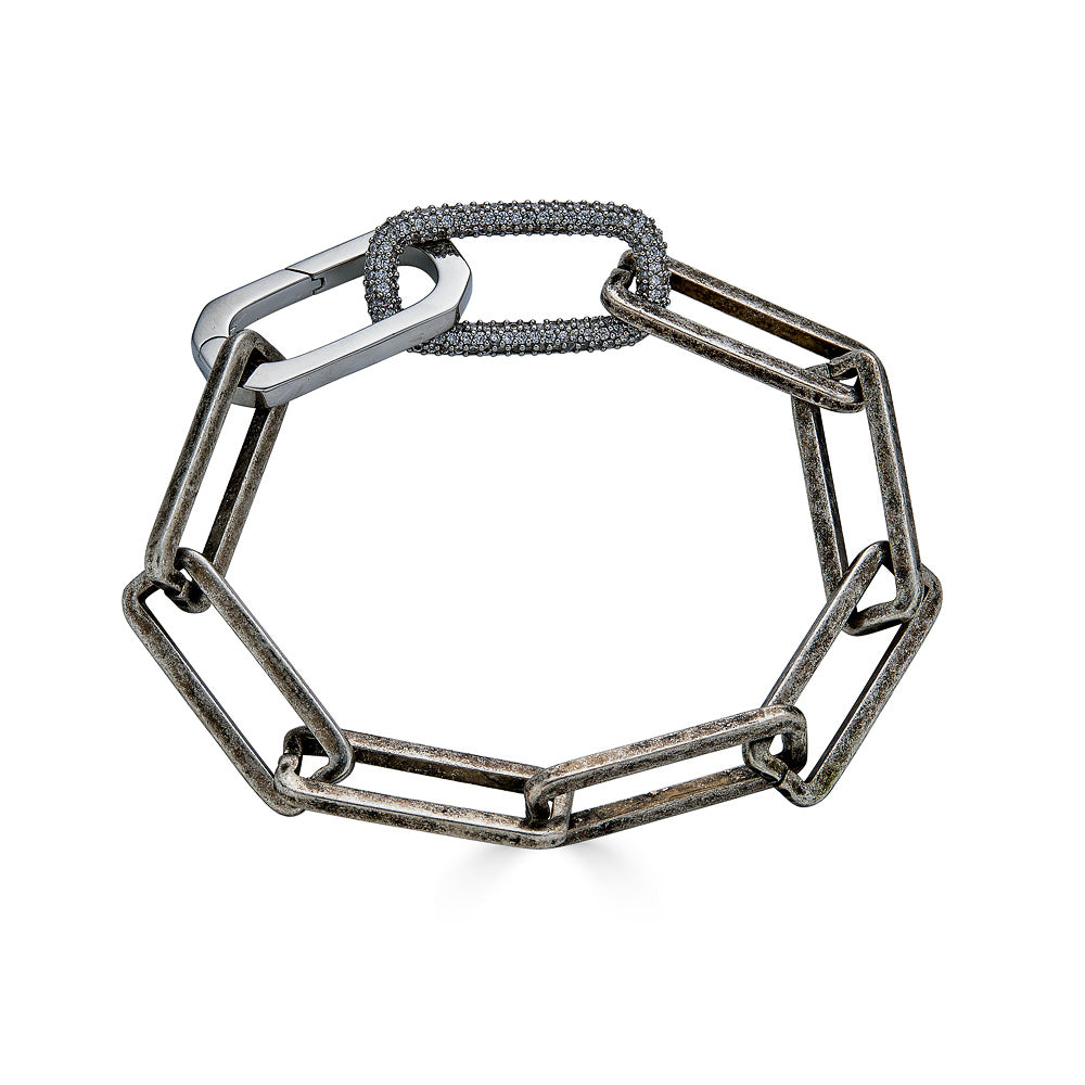 A silver paperclip chain bracelet with pave link detail.