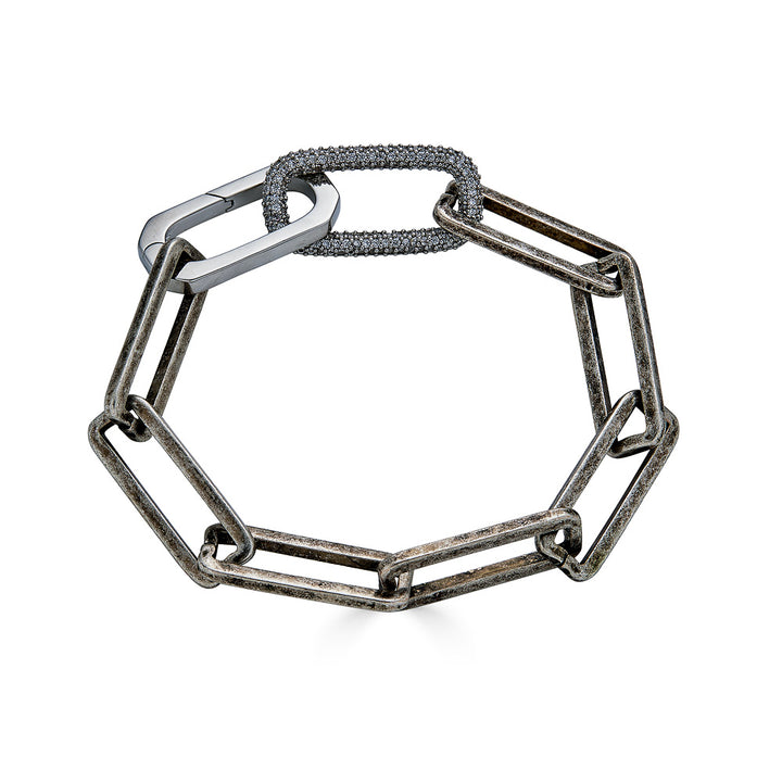 A silver paperclip chain bracelet with pave link detail.