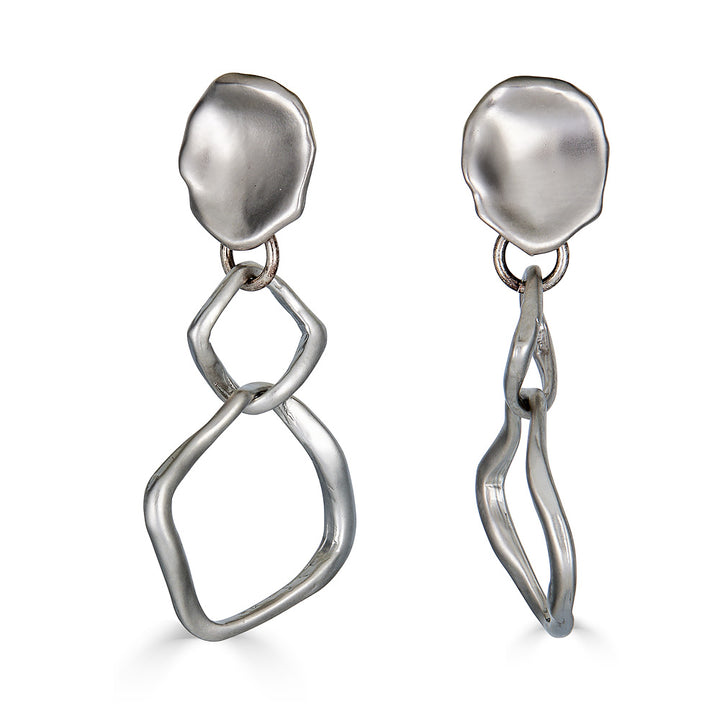 A matte silver dangle earring with nested square detail on a lotus leaf post.