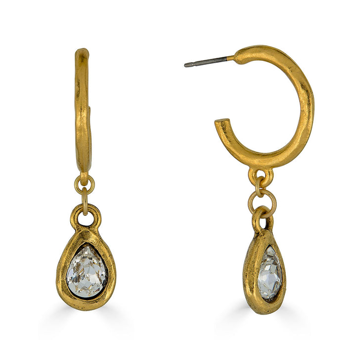Matte gold hoop earrings with dangling teardrop-shaped faceted crystal charms in sculpted bezels.