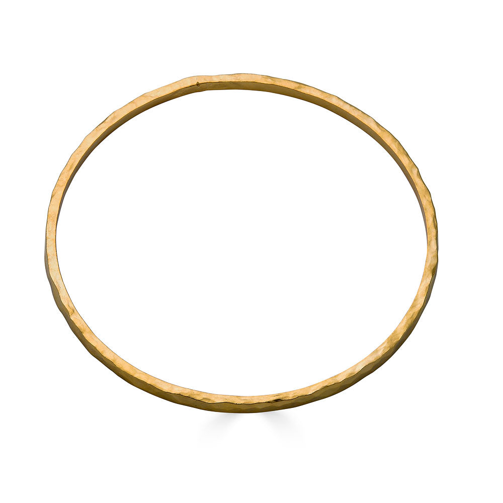 Wide hammered gold bangle bracelet with organic hand-forged texture.