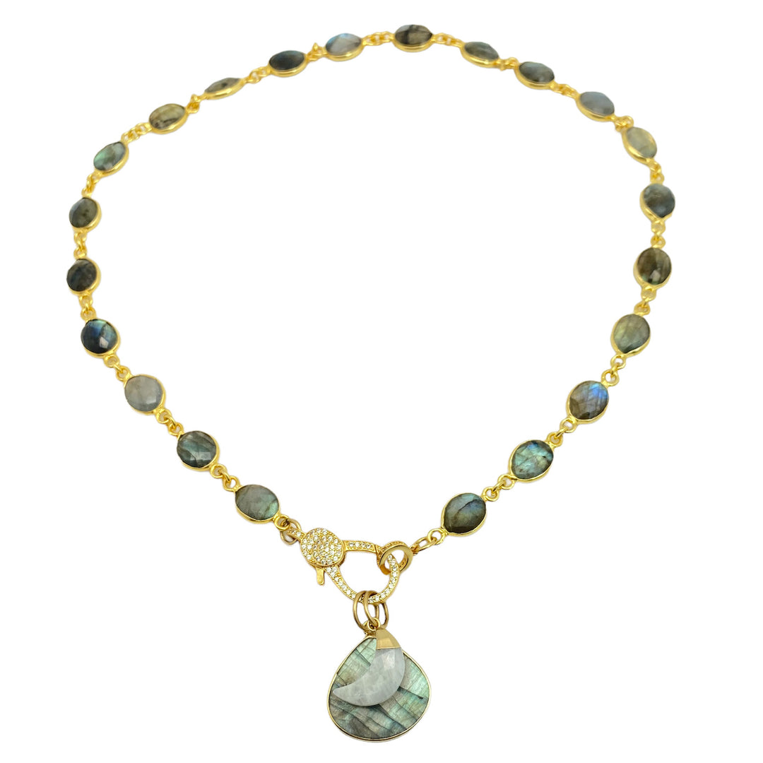 a labradorite necklace with a heart shaped labradorite pendant and a moonstone moon with a pave clasp