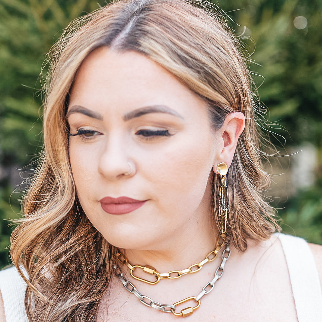 a rhodium and gold paperclip earring with a matte gold post earring