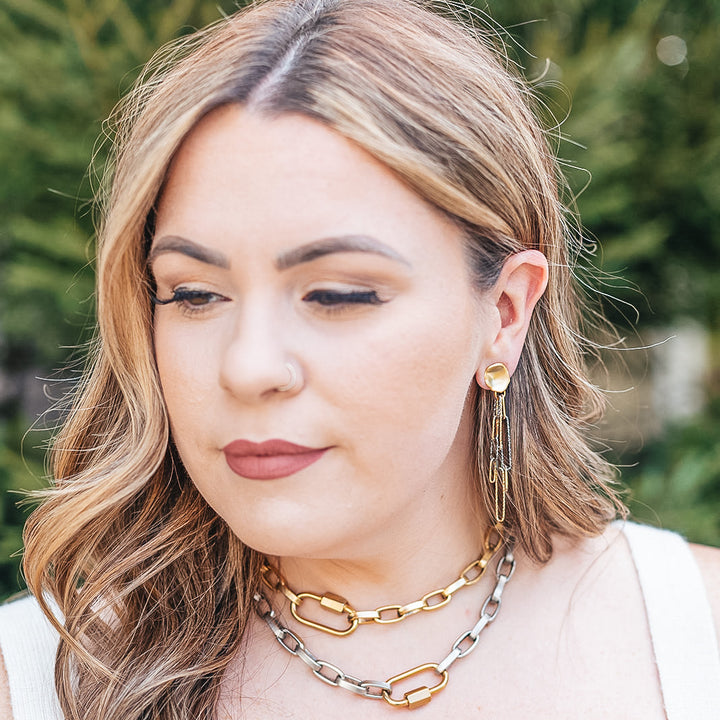 a rhodium and gold paperclip earring with a matte gold post earring