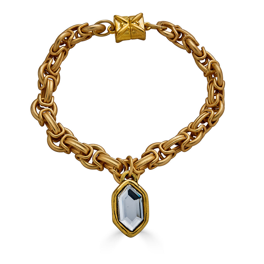 A matte gold byzantine bracelet with a marquis crystal charm and magnetic clasp.