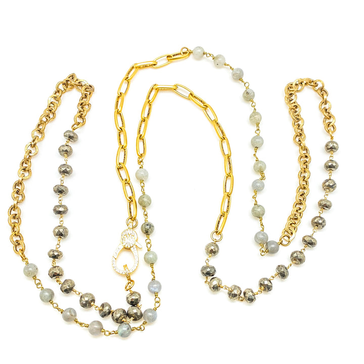 A long pyrite and labradorite gold necklace with pave clasp.