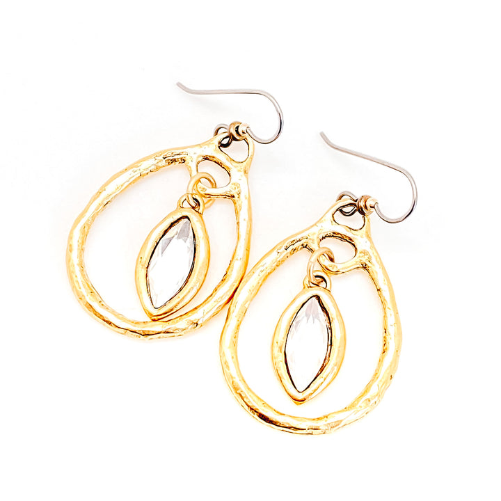 A pair of gold marquis crystal drop earrings.