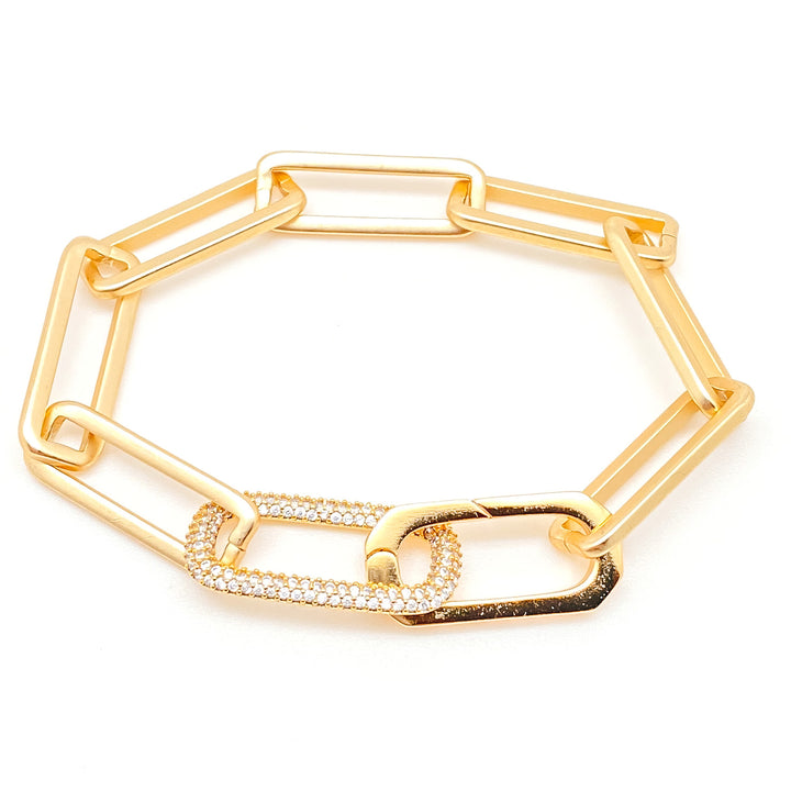 A matte gold paperclip bracelet with pave link.