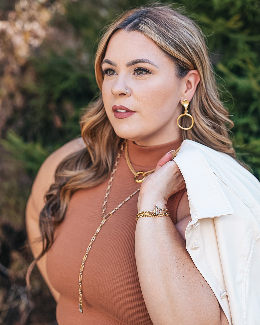 a matte gold two strand necklace with two hammered circles