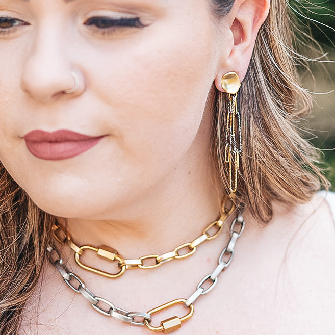 a rhodium and gold paperclip earring with a matte gold post earring