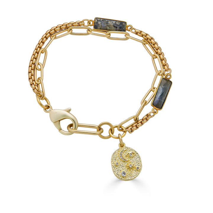A two strand matte gold bracelet with baguette shaped labradorite gemstones and a sun and moon charm