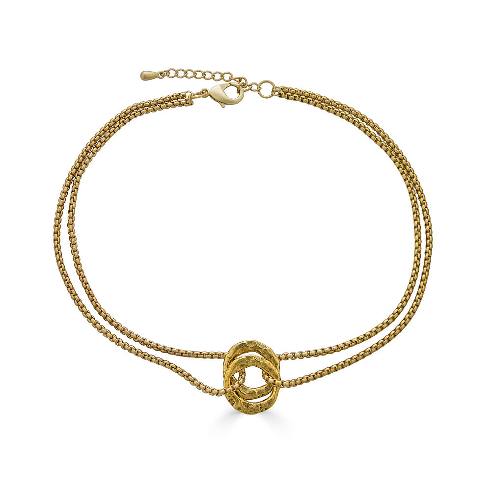 a matte gold two strand necklace with two hammered circles