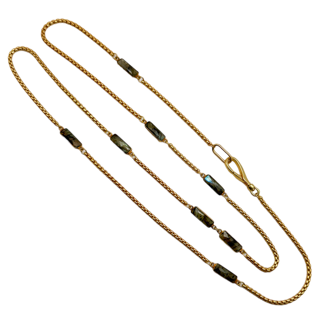 A box chain necklace with baguette cut labradorite gemstones.