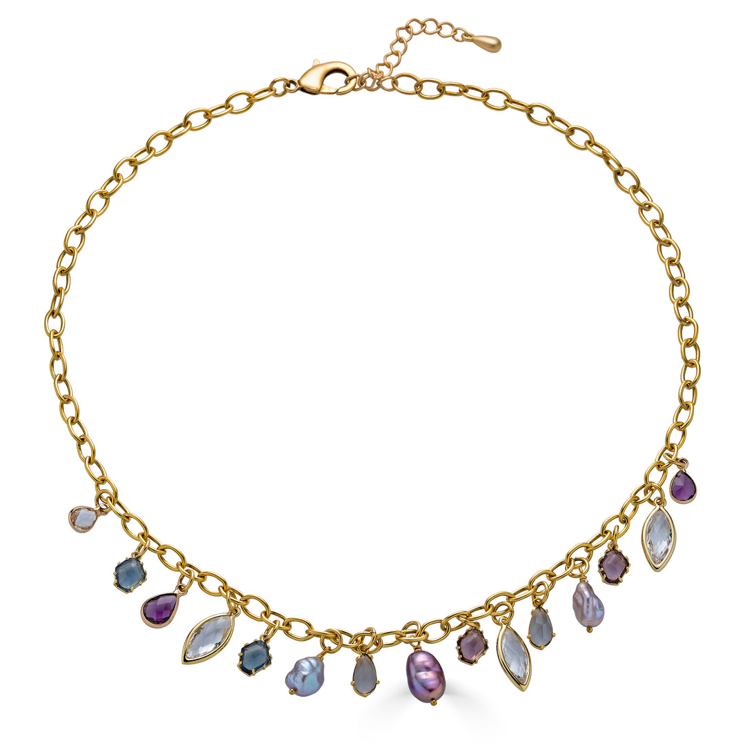 Gold charm necklace with colorful faceted gemstone charms and freshwater pearls dangling from an elongated gold chain.