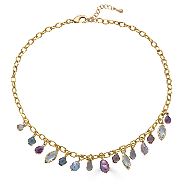 Gold charm necklace with colorful faceted gemstone charms and freshwater pearls dangling from an elongated gold chain.