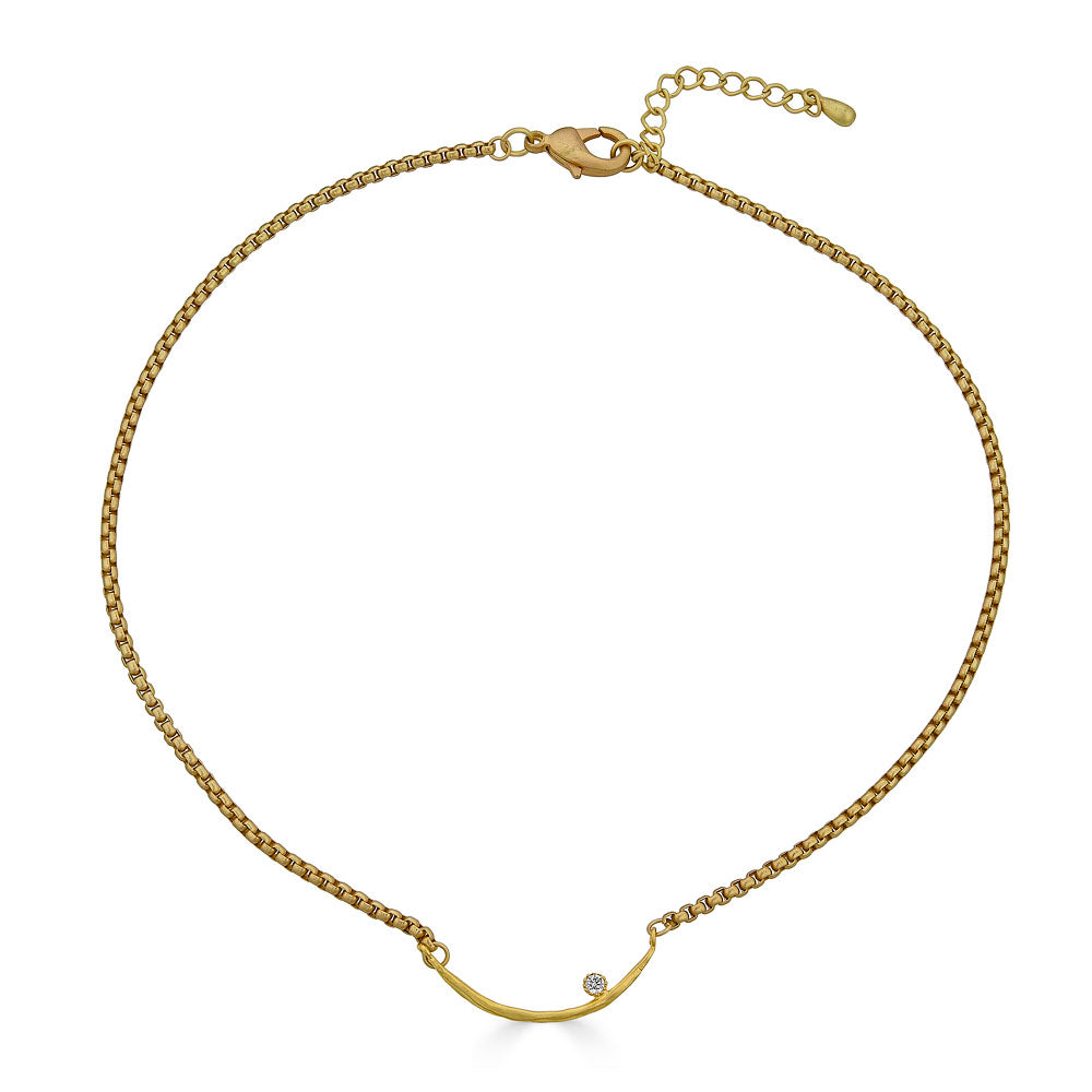 Gold curved bar necklace with a single crystal accent on a box chain.